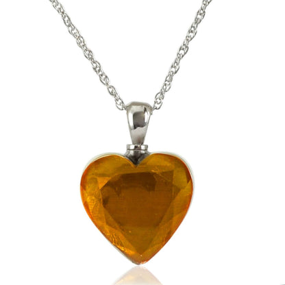 Heart pendant of gold-toned glass rimmed in stainless steel with a top screw fitting