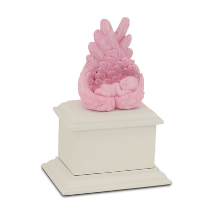 Small pink wooden infant urn with a rounded lid and a soft painted finish