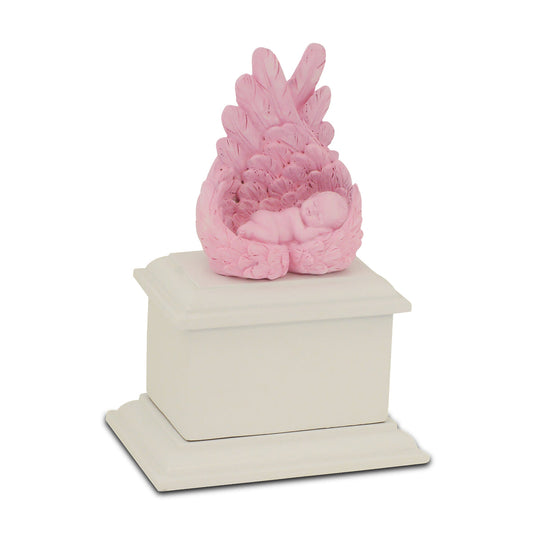 Small pink wooden infant urn with a rounded lid and a soft painted finish