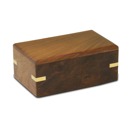 Small wooden pet urn with brass-finished detailing on a warm brown wood body