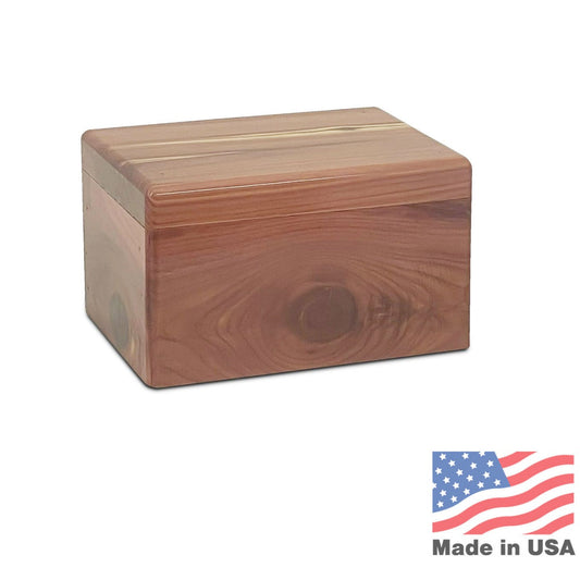 Rectangular wooden pet urn with a warm cedar-toned finish and a flat lid