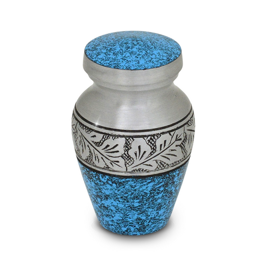 Small keepsake urn in azure blue with a raised leaf motif across the body
