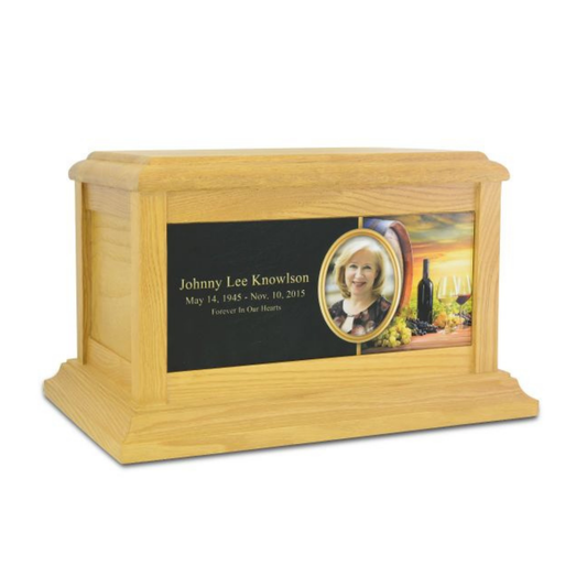 Upright ash wood cremation urn with pale grain and a photo frame set in the front