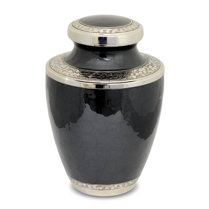 Black enamelled brass cremation urn with a painted floral band around the rounded body