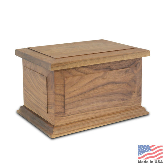Rectangular walnut wood cremation urn with a plain front and visible dark grain