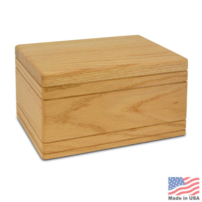 Low wide oak cremation urn with clean edges and a flush-fitting lid