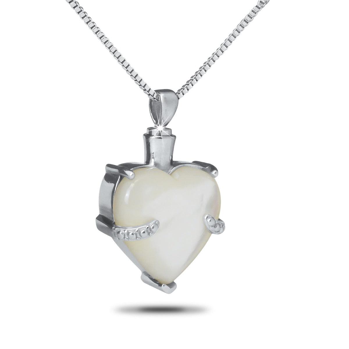 Stainless steel keepsake with a pale iridescent marble inlay set flush into the face