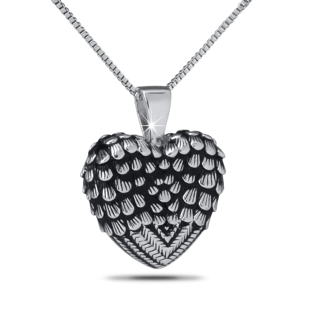 Silver pendant combining a feather, outspread wings, and a raised heart