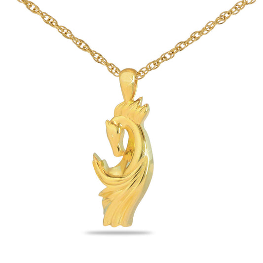 Gold-toned pendant with a running horse worked in relief, about one inch tall
