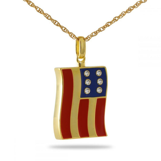 Gold steel cremation pendant with the American flag stars and stripes across the front