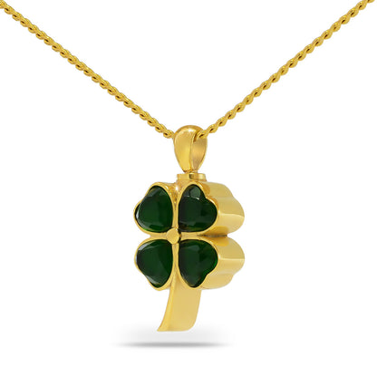 Gold cremation pendant with a green glass shamrock set into the front