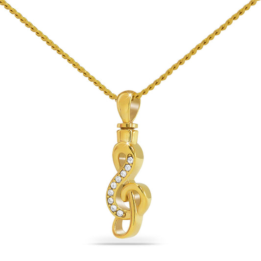 Gold-toned steel pendant with a treble clef and musical notes raised on the face