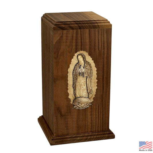 Tall walnut wood cremation urn with an image of Our Lady of Guadalupe on the front