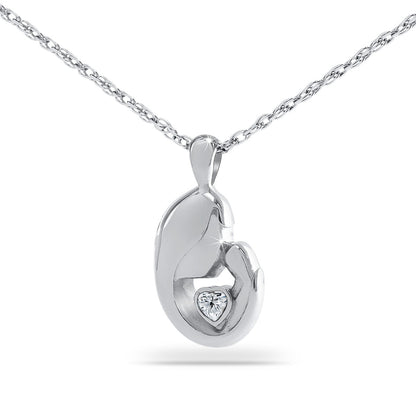 Stainless steel pendant with a pale opaque white stone set into the front
