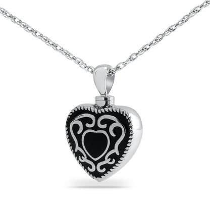 Matte black steel heart keepsake urn with western scrollwork tooled into the front