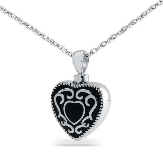 Matte black steel heart keepsake urn with western scrollwork tooled into the front