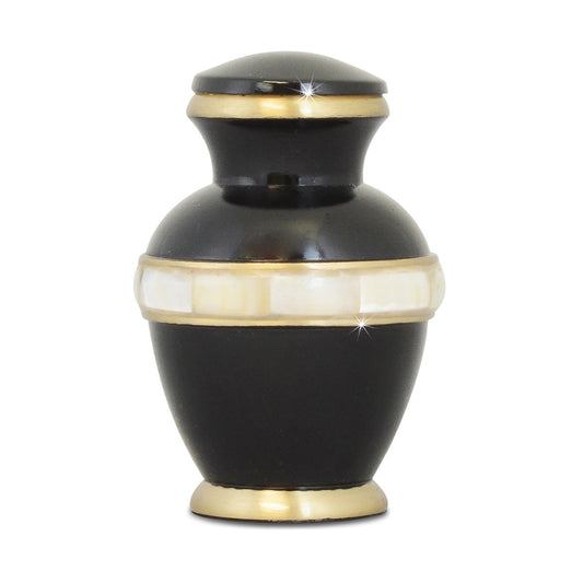 Small black urn with iridescent mother of pearl inlay panels set into a brass body