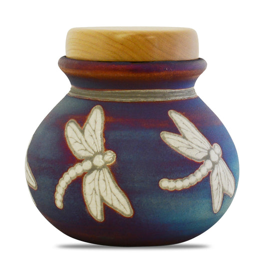 Raku ceramic keepsake urn with a dragonfly motif and an iridescent crackled glaze