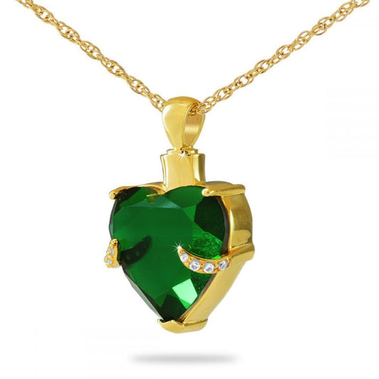 Heart pendant with a faceted green glass center framed in gold plated steel