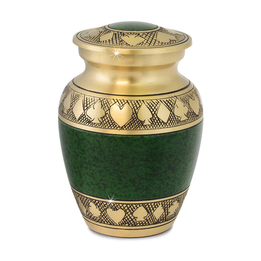 Green keepsake urn with a poker themed design, about four inches tall with a domed lid