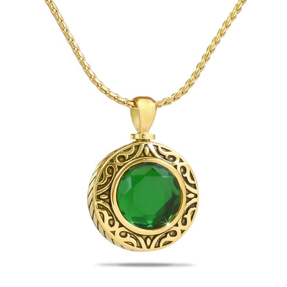 Tiny green glass keepsake globe set in a gold-toned steel frame with a screw top