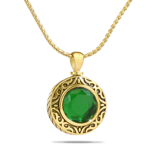 Tiny green glass keepsake globe set in a gold-toned steel frame with a screw top