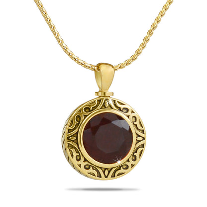 Small light red glass keepsake sphere in a gold-toned steel setting with a threaded cap