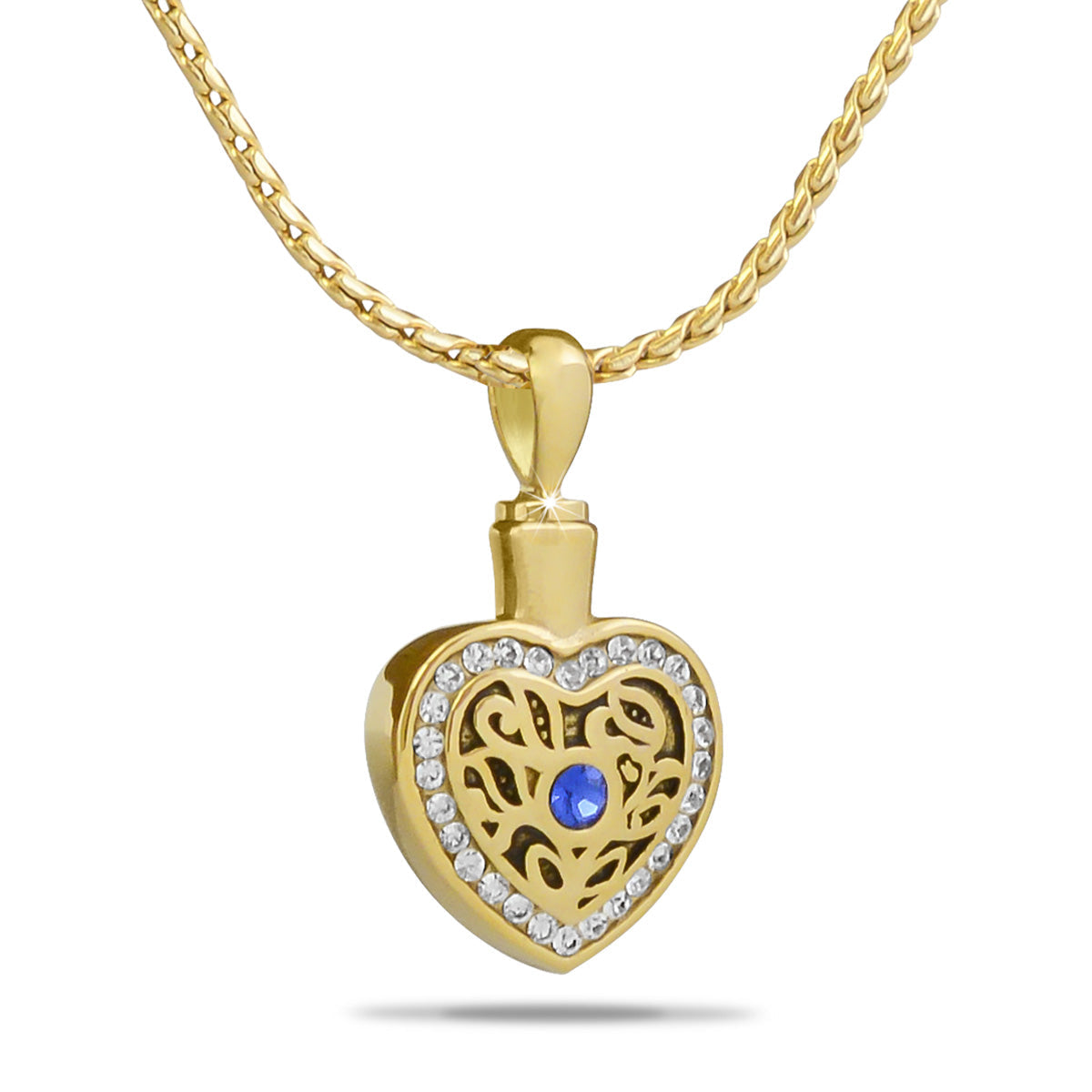 Gold-toned steel heart pendant edged with clear crystals and a small top opening