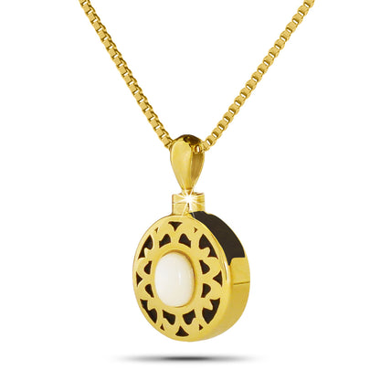 Gold-toned cremation pendant with a round white stone at the center, hanging on a chain