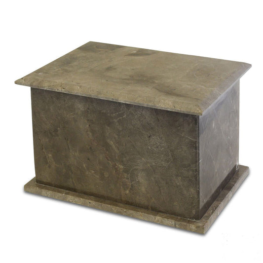 Low rectangular stone cremation urn with a plain polished face and no ornament