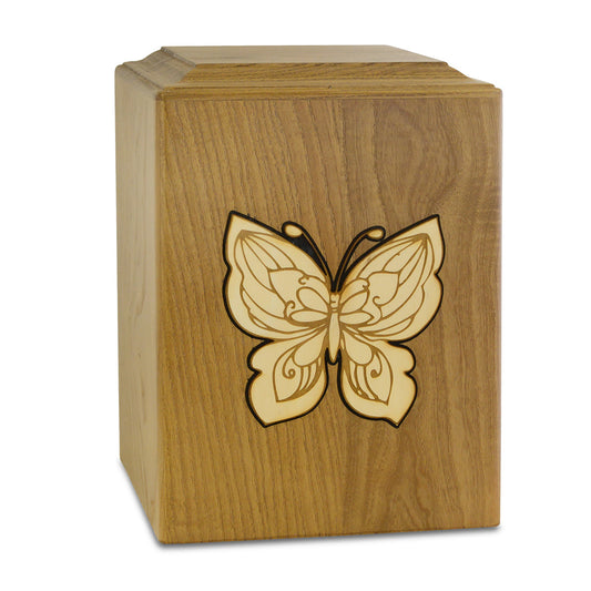 Wooden cremation urn with gold-toned butterflies rising across the front panel