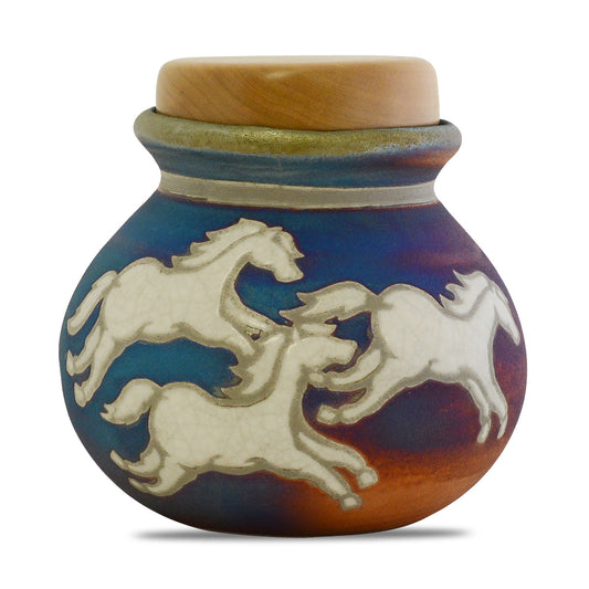 Round raku ceramic keepsake urn with running horse motif on a dark crackled glaze