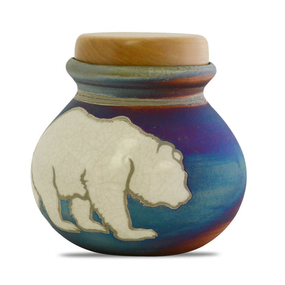 Round raku ceramic keepsake urn with a bear motif on crackled copper-toned glaze