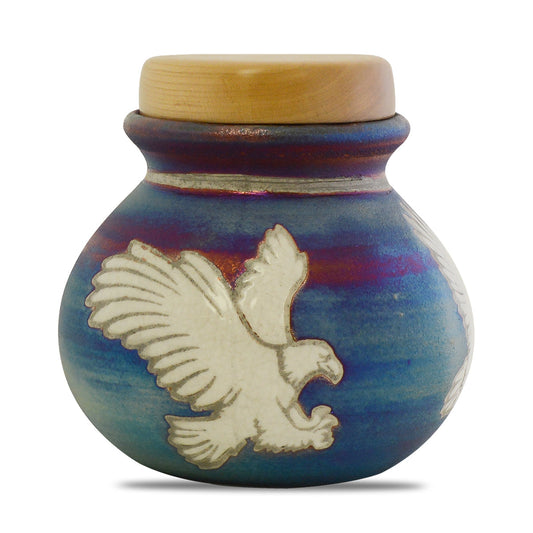 Raku ceramic keepsake urn with an eagle in relief under a crackled copper-toned glaze