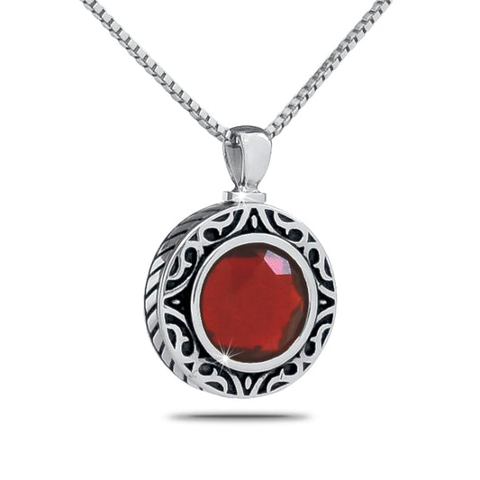 Small steel cremation pendant with a round deep red January birthstone set in the front