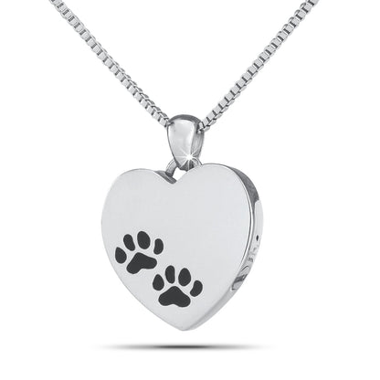 Slim stainless steel heart pendant with a cut-out paw print, just over an inch tall