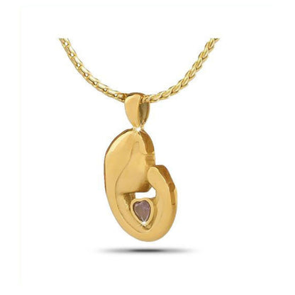 Gold-toned steel keepsake about one inch tall set with a polished purple stone