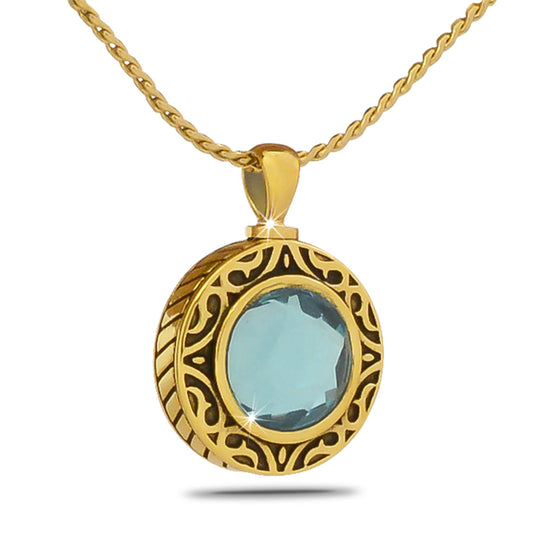 Tiny pale blue glass keepsake bead held in a gold-toned steel frame with a screw cap