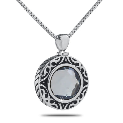 Polished steel keepsake urn with a pale lavender stone set into the domed top