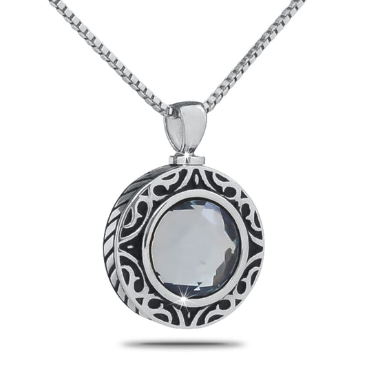 Polished steel keepsake urn with a pale lavender stone set into the domed top