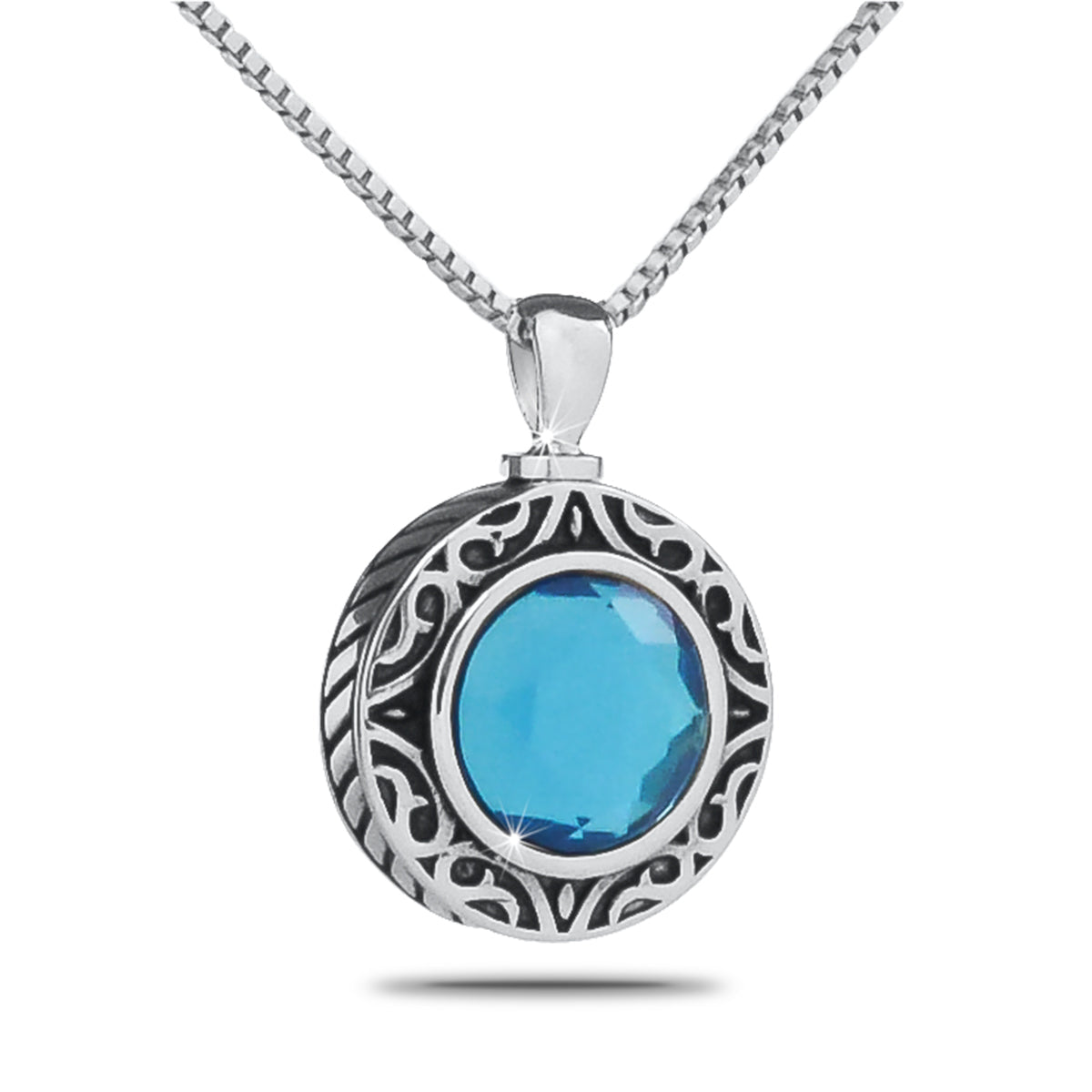 Round silver pendant set with a light blue stone in the center of the face