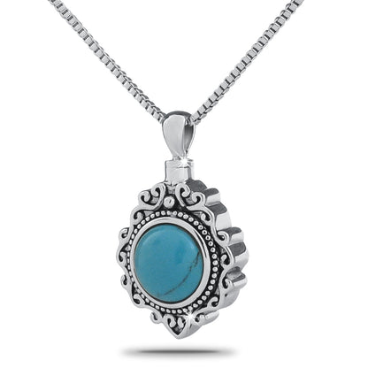Silver pendant with a turquoise stone set into the front, hanging from a matching silver chain