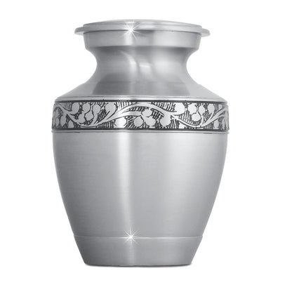 Small brass urn with a rounded body, tapered foot and a threaded lid at the top