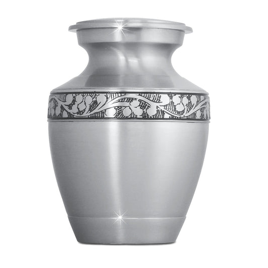 Small brass urn with a rounded body, tapered foot and a threaded lid at the top