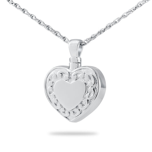Wide polished steel cremation pendant with a sacred motif across the front face