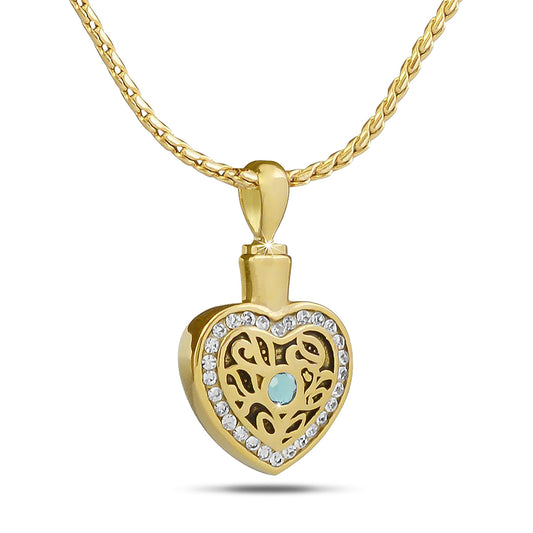 Gold-toned steel keepsake with a pale blue aquamarine stone set above a polished body
