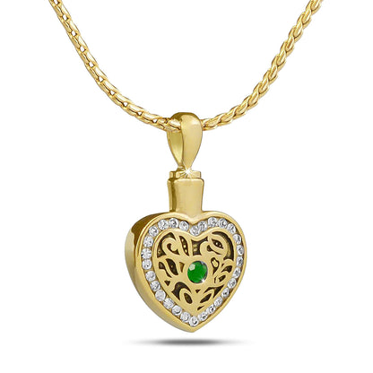 Gold-toned steel pendant set with a deep green emerald colored stone