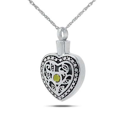 Steel cremation pendant with a yellow green peridot stone set into a mirrored face