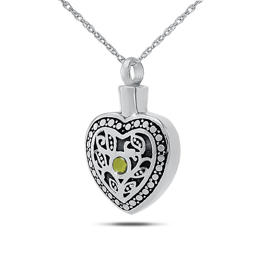Steel cremation pendant with a yellow green peridot stone set into a mirrored face
