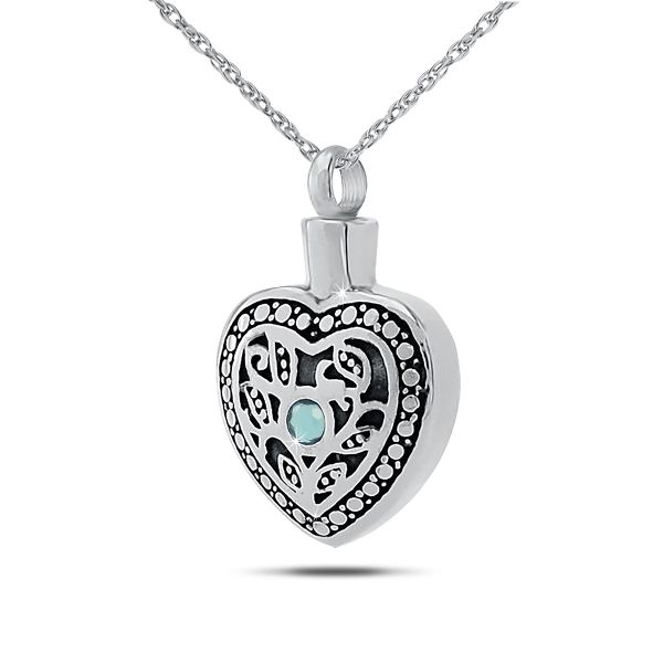 Upright silver pendant set with a pale blue aquamarine above a plain face